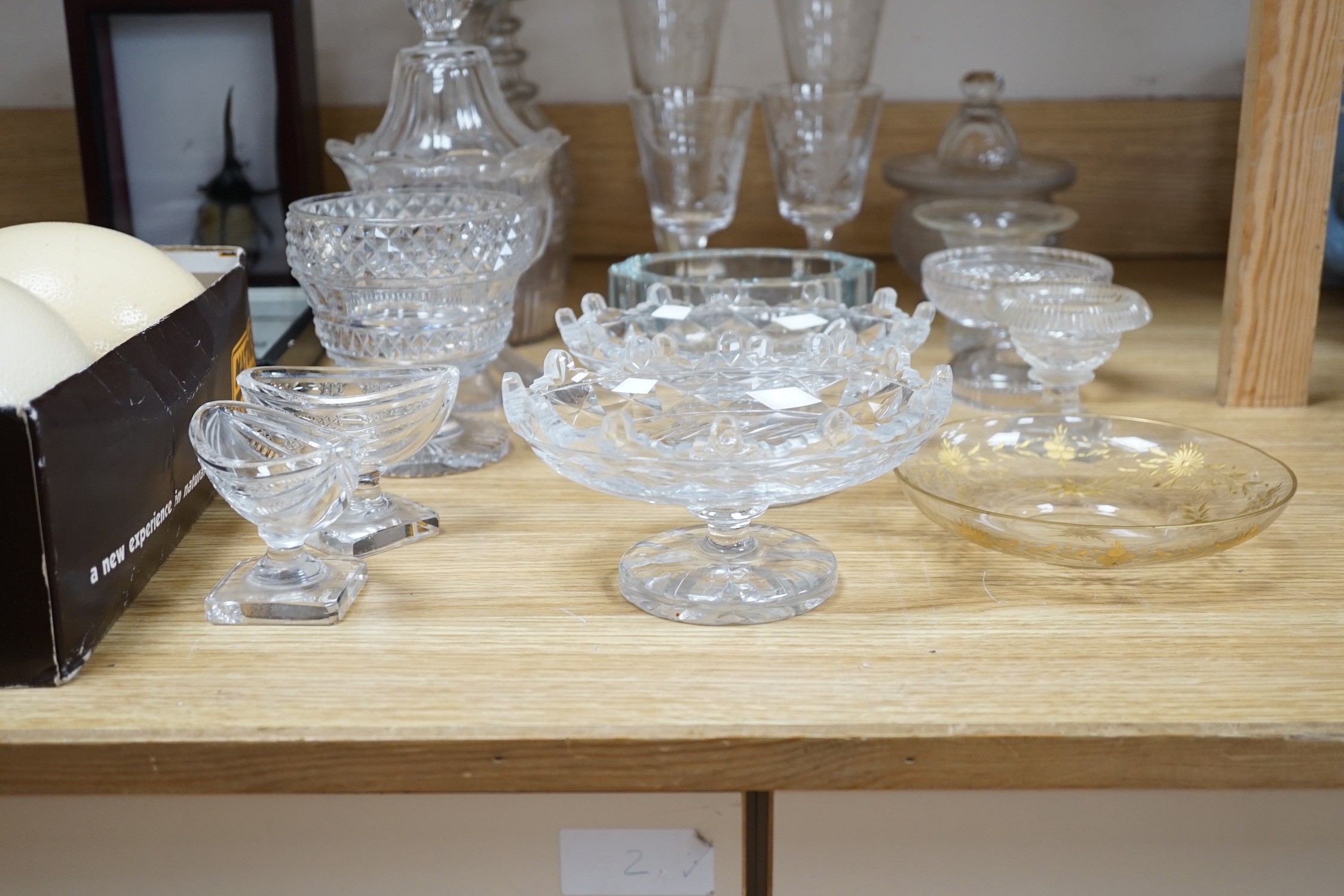 A collection of 19th century hobnail-cut salts, pots, jars and a pair of decanters, etched glasses, etc.